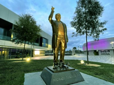 Gudinski Memorial Statue outside Rod Laver Arena with outdoor lighting control surrounding